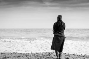 Woman by the ocean.